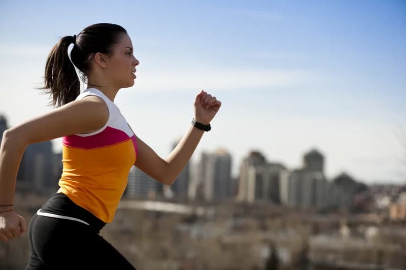 Woman Running in City