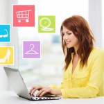 smiling woman with laptop shopping online at home