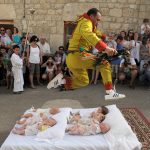 117374793-man-representing-the-devil-leaps-over-babies-during-the.jpg.CROP.promo-large2