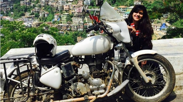 Woman bike rider returns home after riding solo across the nation