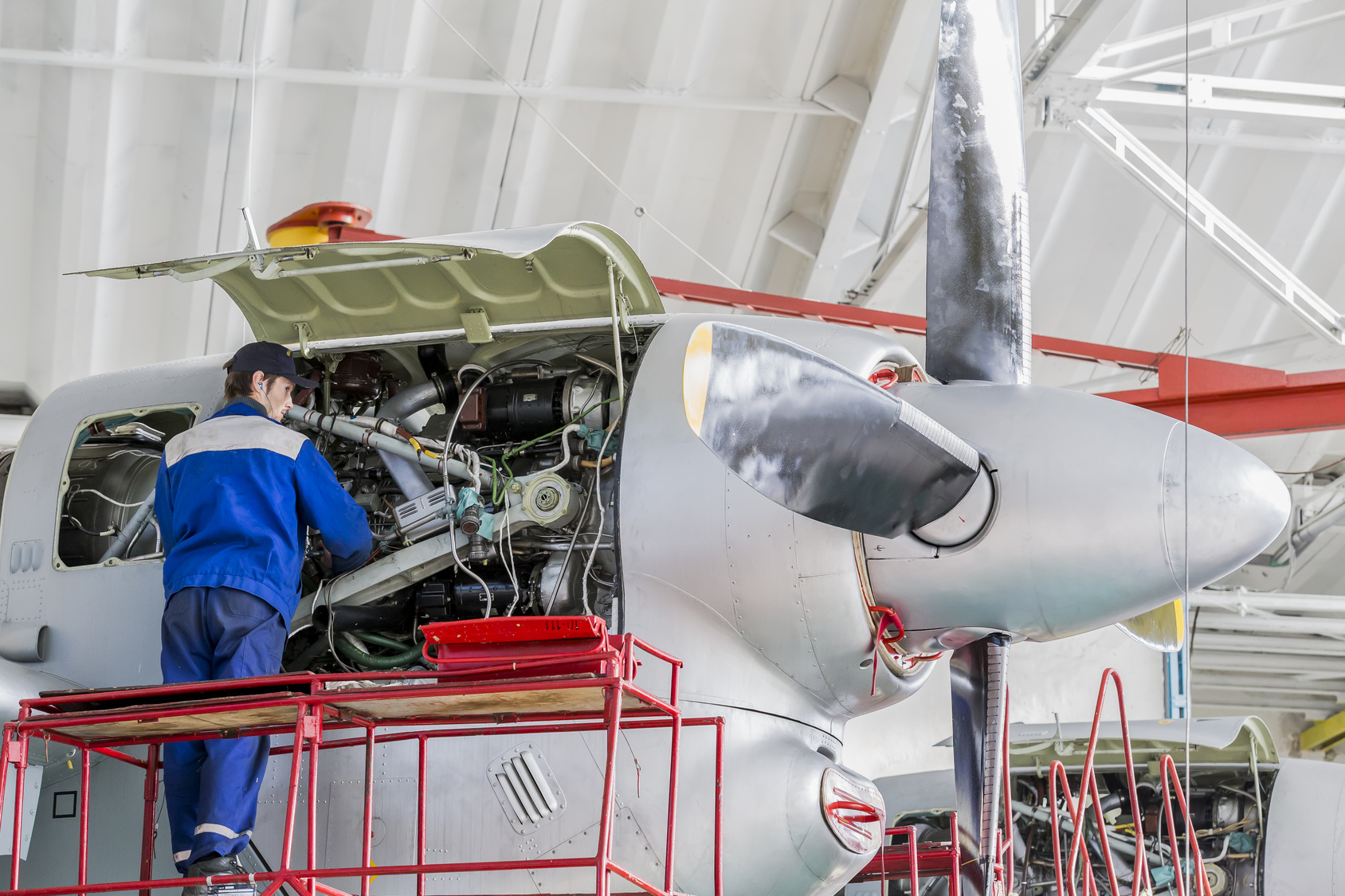 Engineer Aviation Plant Repair Jet Engines In Aviation Hangar Aircraft Under Heavy Maintenance Technician In Blue Working Uniform Youth Incorporated Magazine