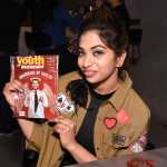 Anandita De holding a copy of youth magazine edt