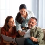 front-view-happy-people-looking-picture-album-1