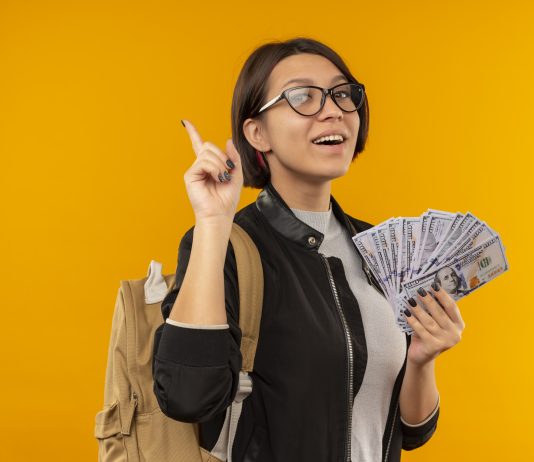 The Real Cost of Studying in Metro Cities: Budget Guide for Students Girl Holding money